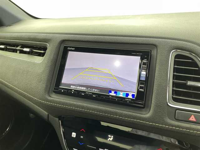 ホンダ ヴェゼル ハイブリッド RS ホンダセンシング 福井県 2019(平31)年 3.5万km プレミアムクリスタルレッドM Gathers 8型SDナビ/型式：VXM-195VFi/FM/AM/フルセグ/Bluetooth/USB】/バックカメラ/ビルトインETC/追従式クルーズコントロール/パドルシフト/ハーフレザーシート/シートヒーター/オートブレーキホールド/ドアバイザー/SPORT MODE/スペアキー/スマートキー/プッシュスタート/フォグライト/リヤフォッガー/オートライト/LEDヘッドライト/純正フロアマット/ホンダセンシング/取扱説明書/新車時保証書