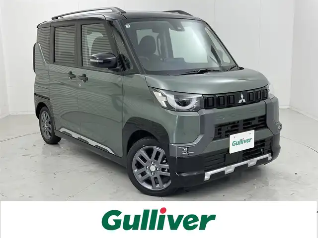 三菱 デリカミニ T プレミアム 茨城県 2025(令7)年 0.1千km ＤグリーンⅡ 届出済未使用車/純正9型DA/全周囲カメラ/デジタルインナーミラー/リヤサーキュレーター（プラズマクラスター付）/衝突被害軽減ブレーキ/車線逸脱抑制装置/レーダークルーズコントロール/オートマチックハイビーム/クリアランスソナー/両側電動スライドドア/ハーフレザーシート/シートヒーター/ステアリングヒーター/純正15インチAW/LEDヘッドライト/スマートキー