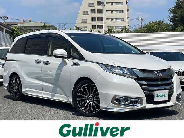 ホンダ オデッセイ アブソルート 東京都 2015(平27)年 7.1万km ホワイトオーキッドパール 純正ナビ/（フルセグ/BT/DVD/CDFM/AM）/360度カメラ/ドライブレコーダー　ETC/ホンダセンシング/アダプティブクルーズコントロール/車線維持支援システム/フリップダウンモニター/両側パワースライドドア/スマートキー×２/社外18インチAW（無限製）/新車時保証書/取扱説明書