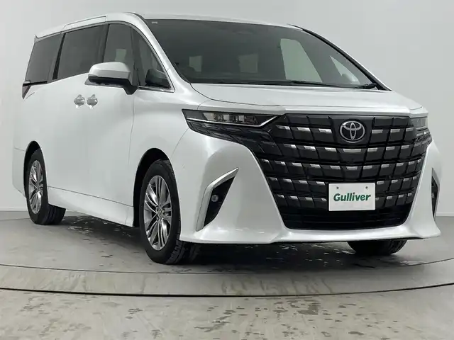 トヨタ アルファード Z 熊本県 2023(令5)年 2.5万km プラチナホワイトパールマイカ ワンオーナー/左右独立ムーンルーフ　/後席モニター　/純正１４型ＤＡナビ　/全方位カメラ　/セーフティセンス　/ＰＫＳＢ　/ＢＳＭ　/パーキングアシスト　/両側電動スライドドア　/パワーバックドア　/３眼ＬＥＤヘッドライト　/デジタルルームミラー/ビルトインETC２．０/シートベンチレーション／ヒーター/ステアリングヒーター/ワイヤレス充電