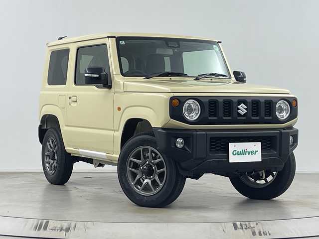 スズキ ジムニー XC 埼玉県 2024(令6)年 0.1千km シフォンアイボリーM 背面タイヤ　/シートヒーター　/衝突軽減システム　/クルーズコントロール　/レーンキープアシスト/後方コーナーセンサー/ダウンヒルアシスト　/純正アルミホイール　/純正フロアマット　/ヘッドライトウォッシャー　/ヒーテッドドアミラー/アイドリングストップ/スマートキー/LEDヘッドライト/フォグランプ/オートライト