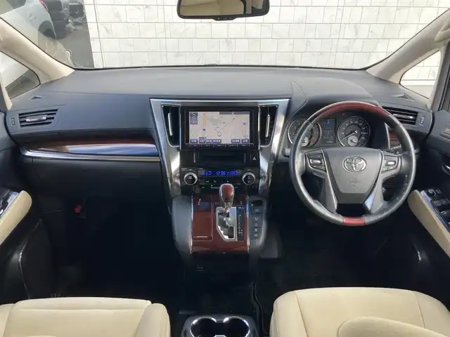 トヨタ ヴェルファイア V 静岡県 2016(平28)年 2.7万km バーニングブラッククリスタルシャインガラスフレーク 純正9インチナビ(NSZT-Y64T)/　AM FM CD DVD Bluetooth SD/フルセグTV/バックモニター/LEDオートヘッドランプ/ハーフレザーシート/運転席パワーシート/クルーズコントロール/前後方クリアランスソナー/両側パワースライドドア/純正17インチアルミホイール/スマートキー2本/ワンオーナー/後席11インチフリップダウンモニター(V11T-R62C)/ビルトインETC