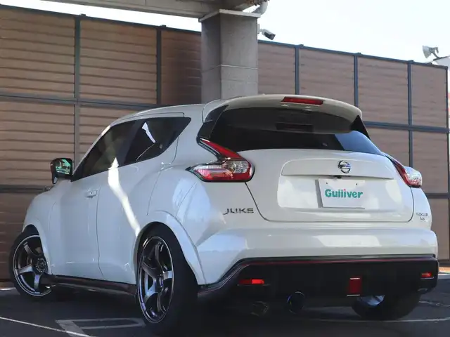 日産 ジューク ニスモ RS 愛知県 2015(平27)年 9.6万km ブリリアントホワイトパール ニスモ専用チューン/純正エアロパーツ/スマートキー×2プッシュスタート/アドバンレーシング18インチアルミホイール/（TC-4）/柿本改マフラー（純正有り）/BLITZ車校調（純正有り）/ニスモ専用シート・フロアマット・スカッフプレート/純正ナビ・フルセグTV・BLUETOOTHオーディオ・DVD・SD（MC314D-W）/バックカメラ/ETC/パドルシフト/純正ディスチャージヘッドライト/純正LEDアクセラリーライナー/オートライト/横滑防止装置/保証書・取扱説明書・ナビ取扱説明書・スペアキー/車検令和8年6月24日/走行距離95673km