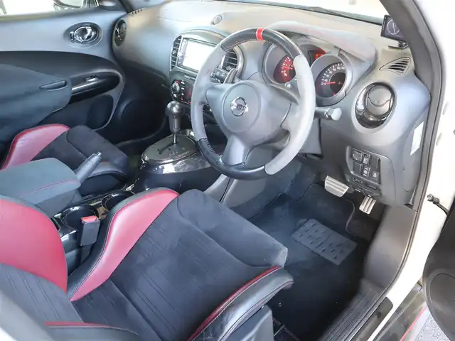 日産 ジューク ニスモ RS 愛知県 2015(平27)年 9.6万km ブリリアントホワイトパール ニスモ専用チューン/純正エアロパーツ/スマートキー×2プッシュスタート/アドバンレーシング18インチアルミホイール/（TC-4）/柿本改マフラー（純正有り）/BLITZ車校調（純正有り）/ニスモ専用シート・フロアマット・スカッフプレート/純正ナビ・フルセグTV・BLUETOOTHオーディオ・DVD・SD（MC314D-W）/バックカメラ/ETC/パドルシフト/純正ディスチャージヘッドライト/純正LEDアクセラリーライナー/オートライト/横滑防止装置/保証書・取扱説明書・ナビ取扱説明書・スペアキー/車検令和8年6月24日/走行距離95673km