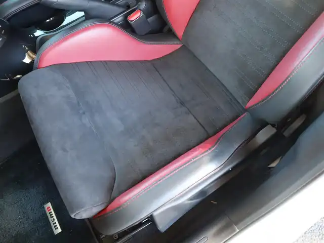 日産 ジューク ニスモ RS 愛知県 2015(平27)年 9.6万km ブリリアントホワイトパール ニスモ専用チューン/純正エアロパーツ/スマートキー×2プッシュスタート/アドバンレーシング18インチアルミホイール/（TC-4）/柿本改マフラー（純正有り）/BLITZ車校調（純正有り）/ニスモ専用シート・フロアマット・スカッフプレート/純正ナビ・フルセグTV・BLUETOOTHオーディオ・DVD・SD（MC314D-W）/バックカメラ/ETC/パドルシフト/純正ディスチャージヘッドライト/純正LEDアクセラリーライナー/オートライト/横滑防止装置/保証書・取扱説明書・ナビ取扱説明書・スペアキー/車検令和8年6月24日/走行距離95673km