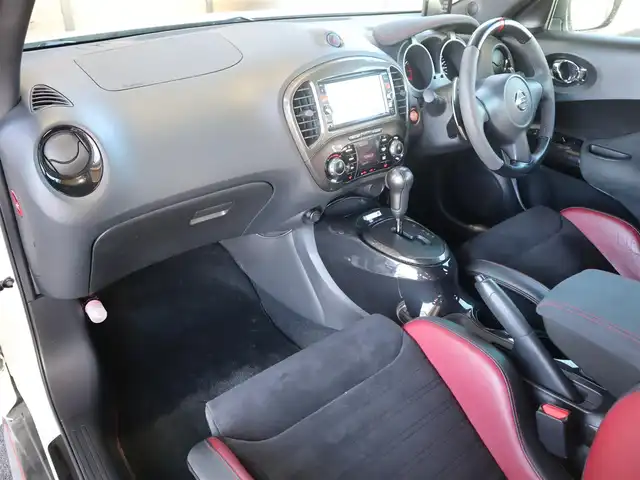 日産 ジューク ニスモ RS 愛知県 2015(平27)年 9.6万km ブリリアントホワイトパール ニスモ専用チューン/純正エアロパーツ/スマートキー×2プッシュスタート/アドバンレーシング18インチアルミホイール/（TC-4）/柿本改マフラー（純正有り）/BLITZ車校調（純正有り）/ニスモ専用シート・フロアマット・スカッフプレート/純正ナビ・フルセグTV・BLUETOOTHオーディオ・DVD・SD（MC314D-W）/バックカメラ/ETC/パドルシフト/純正ディスチャージヘッドライト/純正LEDアクセラリーライナー/オートライト/横滑防止装置/保証書・取扱説明書・ナビ取扱説明書・スペアキー/車検令和8年6月24日/走行距離95673km