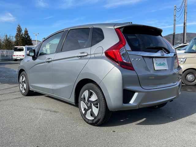 ホンダ フィット ハイブリット Fパッケージ 山梨県 2013(平25)年 4.7万km ティンテッドシルバーM 福祉車　/純正ＨＤＤナビ　/フルセグＴＶ　/バックカメラ　/純正ビルトインＥＴＣ　/Ｂｌｕｅｔｏｏｔｈ／ＵＳＢ　/ドラレコ　/純正フロアマット　/ＡＢＳ　/横滑り防止装置　/盗難防止装置　/オートライト　/Ｗエアバッグ