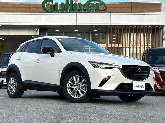 マツダ ＣＸ－３ 15S アーバンドレッサー 沖縄県 2023(令5)年 1.5万km スノーフレイクホワイトパールマイカ 純正ナビ・TV・Bluetooth・CD/DVD/全方位カメラ/前後ドラレコ　/コーナーセンサー/オートライト/シートヒーター・ハンドルヒーター/スマートブレーキサポート/追従機能付きレーダークルーズコントロール/BSM/レーンキープアシスト/誤発進抑制制御