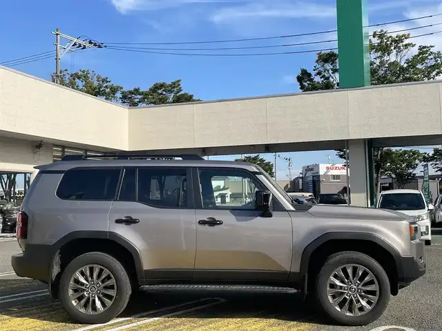 トヨタ ランドクルーザー ２５０ VX 宮城県 2025(令7)年 0.3万km アバンギャルドブロンズメタリック ワンオーナー/純正ナビ/(AM、FM、BT、フルセグTV)/サンルーフ/ルーフレール/スペアキー/純正アルミホイール/３列シート/レーダークルーズコントロール/パノラマビューモニター/バックカメラ/デジタルインナーミラー/ＥＴＣ２．０/フルレザーシート/パワーバックドア/ラバーマット/デフォッガー/オートライト/プリクラッシュセーフティ/パーキングホールド/プッシュスタートボタン/HDMI端子/Cポート/D、N席シートヒーター/クーラー/D席パワーシート/ヒートデアイサー/ステップ