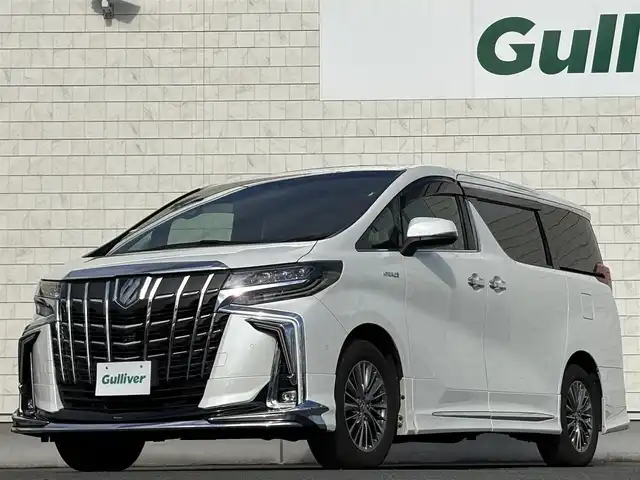 トヨタ アルファードハイブリット エグゼクティブ ラウンジ S 岩手県 2021(令3)年 5万km ホワイトパールクリスタルシャイン 禁煙車/4WD/モデリスタフルエアロ/モデリスタマフラー/ツインサンルーフ/LBLプレミアムサウンドシステム/ブラックレザーシート/純正フリップダウンモニター/全方位カメラ/パワーバックドア/AC100V電源/パワーシート/シートヒーター/エアシート/ハンドルヒーター/メーカーナビ/→フルセグTV/Bluetooth/CD/DVD/FM/AM/バックカメラ/ステアリングスイッチ/ブラインドスポットモニター/追従型クルーズコントロール/レーンキープアシスト/クリアランスソナー/パーキングサポートブレーキ/衝突軽減システム/リアクロストラフィックアラート/ロードアシストサイン/オートライト/オートハイビーム/LEDヘッドライト/LEDフォグライト/〇プッシュスタート/〇電動格納ミラー/〇ウィンカーミラー/〇ドアバイザー/〇フロアマット/〇USBポート/〇シガーソケット/〇スマートキー/前後ドライブレコーダー/ビルトインETC/オットマン