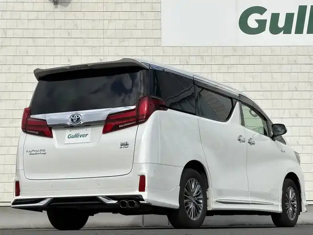 トヨタ アルファードハイブリット エグゼクティブ ラウンジ S 岩手県 2021(令3)年 5万km ホワイトパールクリスタルシャイン 禁煙車/4WD/モデリスタフルエアロ/モデリスタマフラー/ツインサンルーフ/LBLプレミアムサウンドシステム/ブラックレザーシート/純正フリップダウンモニター/全方位カメラ/パワーバックドア/AC100V電源/パワーシート/シートヒーター/エアシート/ハンドルヒーター/メーカーナビ/→フルセグTV/Bluetooth/CD/DVD/FM/AM/バックカメラ/ステアリングスイッチ/ブラインドスポットモニター/追従型クルーズコントロール/レーンキープアシスト/クリアランスソナー/パーキングサポートブレーキ/衝突軽減システム/リアクロストラフィックアラート/ロードアシストサイン/オートライト/オートハイビーム/LEDヘッドライト/LEDフォグライト/〇プッシュスタート/〇電動格納ミラー/〇ウィンカーミラー/〇ドアバイザー/〇フロアマット/〇USBポート/〇シガーソケット/〇スマートキー/前後ドライブレコーダー/ビルトインETC/オットマン