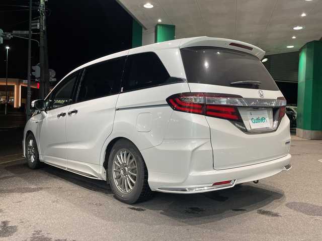 ホンダ オデッセイ ハイブリッド 福島県 2016(平28)年 15.1万km ホワイトオーキッドパール ワンオーナー車/純正SDナビ/〇フルセグTV/〇Bt/〇FM＆AM/〇SD/〇DISC（CD＆DVD）/〇リアモニタHDMI/バックカメラ/純正ETC/オートライト/ステアリングボタン/追従クルーズコントロール/純正フリップダウンモニター/リモコン/パワーシート（D席）/シートヒーター（D＋N席）/両面パワースライドドア/社外夏タイヤ4本積載（225/40R19）