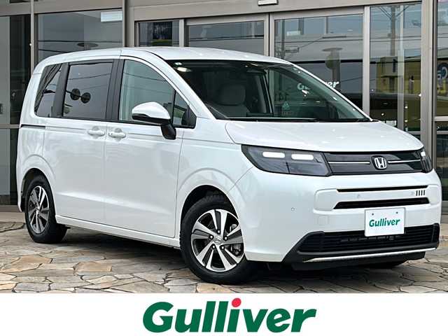 ホンダ フリード AIR EX 静岡県 2024(令6)年 0.5万km プラチナホワイトパール 純正ナビ/・FM/・AM/・TV/・Apple Car Play/・Android Auto/・Bluetooth/・USB/主要装備/・バックカメラ/・ホンダセンシング/・車線逸脱防止/・誤発進抑制/・コーナーセンサー/・追従クルコン/・横滑り防止装置/・ＬＥＤヘッドライト/・サイドカーテンエアバッグ/・純正フロアマット/・運転席+助手席シートヒーター/・リヤクーラー