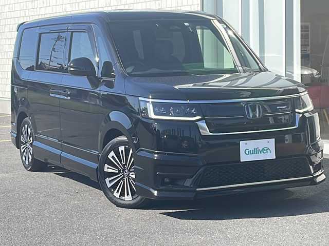 ホンダ ステップワゴン スパーダ eHEV プレミアムライン 香川県 2022(令4)年 6.6万km クリスタルブラックパール 無限エアロ（フロント　サイド　リア）/純正１１．４インチナビ/純正１５．６インチリアモニター/両側パワースライドドア/パワーバックドア/ＢＳＭ/シートヒーター/フルセグＴＶ/ＥＴＣ/コーナーセンサー/CD/DVD再生可能/レーダークルーズ
