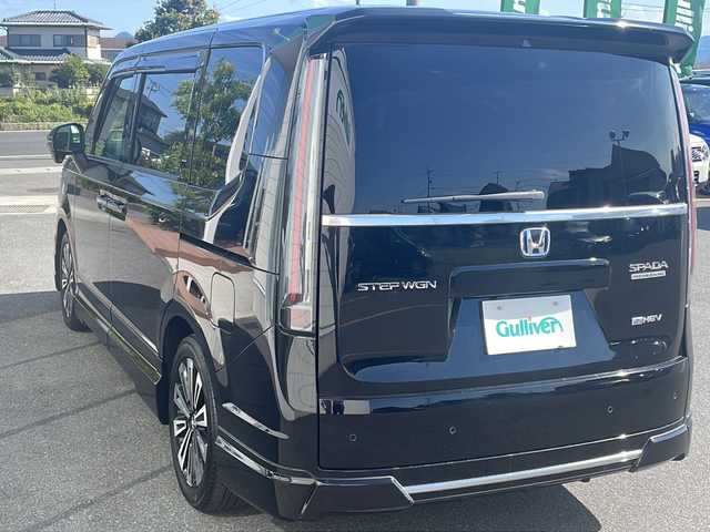 ホンダ ステップワゴン スパーダ eHEV プレミアムライン 香川県 2022(令4)年 6.6万km クリスタルブラックパール 無限エアロ（フロント　サイド　リア）/純正１１．４インチナビ/純正１５．６インチリアモニター/両側パワースライドドア/パワーバックドア/ＢＳＭ/シートヒーター/フルセグＴＶ/ＥＴＣ/コーナーセンサー/CD/DVD再生可能/レーダークルーズ