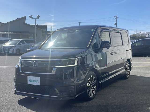 ホンダ ステップワゴン スパーダ eHEV プレミアムライン 香川県 2022(令4)年 6.6万km クリスタルブラックパール 無限エアロ（フロント　サイド　リア）/純正１１．４インチナビ/純正１５．６インチリアモニター/両側パワースライドドア/パワーバックドア/ＢＳＭ/シートヒーター/フルセグＴＶ/ＥＴＣ/コーナーセンサー/CD/DVD再生可能/レーダークルーズ