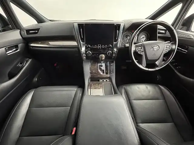 トヨタ アルファードハイブリット エグゼクティブ ラウンジ 道央・札幌 2020(令2)年 6.5万km ブラック ・ワンオーナー/・４WD/・寒冷地仕様/・メーカーOPナビ/　CD/DVD/SD/BT/フルセグ/・純正フリップダウンモニター/・JBLサウンドシステム/・パノラミックビューモニター/・デジタルインナーミラー/・ワイヤレス充電/・ビルトインETC2.0/・トヨタセーフティセンス/・プリクラッシュセーフティ/・レーダークルーズコントロール/・オートハイビーム/・レーントレーシングアシスト/・パーキングサポートブレーキ/・ブラインドスポットモニター/・リヤクロストラフィックアラート/・ロードサインアシスト/・nanoe/・フロントデアイサー/・レザーシート/・全席パワーシート/・全席シートヒーター/・全席シートベンチレーション/・両側パワースライドドア/・パワーバックドア/・ステアリングヒーター/・純正フロアマット/・ドアバイザー/・プッシュスタート/・スマートキー