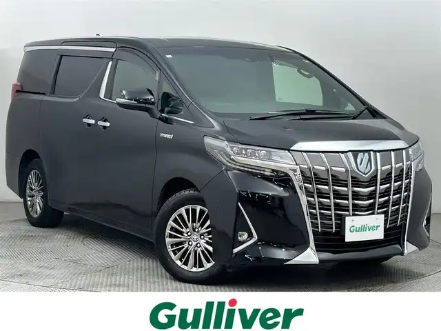 トヨタ アルファードハイブリット エグゼクティブ ラウンジ 道央・札幌 2020(令2)年 6.5万km ブラック ・ワンオーナー/・４WD/・寒冷地仕様/・メーカーOPナビ/　CD/DVD/SD/BT/フルセグ/・純正フリップダウンモニター/・JBLサウンドシステム/・パノラミックビューモニター/・デジタルインナーミラー/・ワイヤレス充電/・ビルトインETC2.0/・トヨタセーフティセンス/・プリクラッシュセーフティ/・レーダークルーズコントロール/・オートハイビーム/・レーントレーシングアシスト/・パーキングサポートブレーキ/・ブラインドスポットモニター/・リヤクロストラフィックアラート/・ロードサインアシスト/・nanoe/・フロントデアイサー/・レザーシート/・全席パワーシート/・全席シートヒーター/・全席シートベンチレーション/・両側パワースライドドア/・パワーバックドア/・ステアリングヒーター/・純正フロアマット/・ドアバイザー/・プッシュスタート/・スマートキー