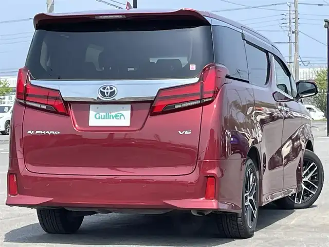 トヨタ アルファード SC 道央・札幌 2020(令2)年 7.3万km ダークレッドマイカメタリック ４WD/JBLプレミアムサウンドシステム/純正ディーラーOPナビ/CD/DVD/BT/フルセグ/純正フリップダウンモニター/トヨタセーフティセンス/プリクラッシュセーフティ/横滑り防止装置/レーダークルーズコントロール/レーンキープアシスト/パーキングアシスト/クリアランスソナー/ブラインドスポットモニター/パーキングサポートブレーキ/リアクロストラフィックアラート/ロードサインアシスト/パノラミックビューモニター/ビルトインETC2.0/ドライブレコーダー/アイドリングストップ/自動防眩ミラー/両側パワースライドドア/パワーバックドア/前席/２列目パワーシート/前席シートヒーター/前席エアシート/D席メモリーシート/N席/２列目オットマン/レザーシート/ステアリングリモコン/ハンドルヒーター/電動パーキング/ブレーキホールド/AC100V/プッシュスタート/スマートキー/LEDヘッドライト/オートライト/オートハイビーム/フォグランプ/電動格納ミラー/ウィンカーミラー/純正フロアマット/ドアバイザー