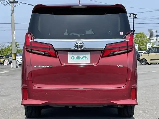 トヨタ アルファード SC 道央・札幌 2020(令2)年 7.3万km ダークレッドマイカメタリック ４WD/JBLプレミアムサウンドシステム/純正ディーラーOPナビ/CD/DVD/BT/フルセグ/純正フリップダウンモニター/トヨタセーフティセンス/プリクラッシュセーフティ/横滑り防止装置/レーダークルーズコントロール/レーンキープアシスト/パーキングアシスト/クリアランスソナー/ブラインドスポットモニター/パーキングサポートブレーキ/リアクロストラフィックアラート/ロードサインアシスト/パノラミックビューモニター/ビルトインETC2.0/ドライブレコーダー/アイドリングストップ/自動防眩ミラー/両側パワースライドドア/パワーバックドア/前席/２列目パワーシート/前席シートヒーター/前席エアシート/D席メモリーシート/N席/２列目オットマン/レザーシート/ステアリングリモコン/ハンドルヒーター/電動パーキング/ブレーキホールド/AC100V/プッシュスタート/スマートキー/LEDヘッドライト/オートライト/オートハイビーム/フォグランプ/電動格納ミラー/ウィンカーミラー/純正フロアマット/ドアバイザー