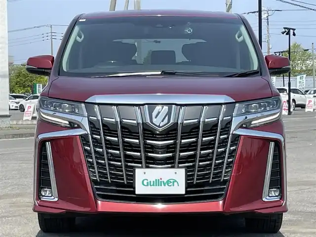 トヨタ アルファード SC 道央・札幌 2020(令2)年 7.3万km ダークレッドマイカメタリック ４WD/JBLプレミアムサウンドシステム/純正ディーラーOPナビ/CD/DVD/BT/フルセグ/純正フリップダウンモニター/トヨタセーフティセンス/プリクラッシュセーフティ/横滑り防止装置/レーダークルーズコントロール/レーンキープアシスト/パーキングアシスト/クリアランスソナー/ブラインドスポットモニター/パーキングサポートブレーキ/リアクロストラフィックアラート/ロードサインアシスト/パノラミックビューモニター/ビルトインETC2.0/ドライブレコーダー/アイドリングストップ/自動防眩ミラー/両側パワースライドドア/パワーバックドア/前席/２列目パワーシート/前席シートヒーター/前席エアシート/D席メモリーシート/N席/２列目オットマン/レザーシート/ステアリングリモコン/ハンドルヒーター/電動パーキング/ブレーキホールド/AC100V/プッシュスタート/スマートキー/LEDヘッドライト/オートライト/オートハイビーム/フォグランプ/電動格納ミラー/ウィンカーミラー/純正フロアマット/ドアバイザー