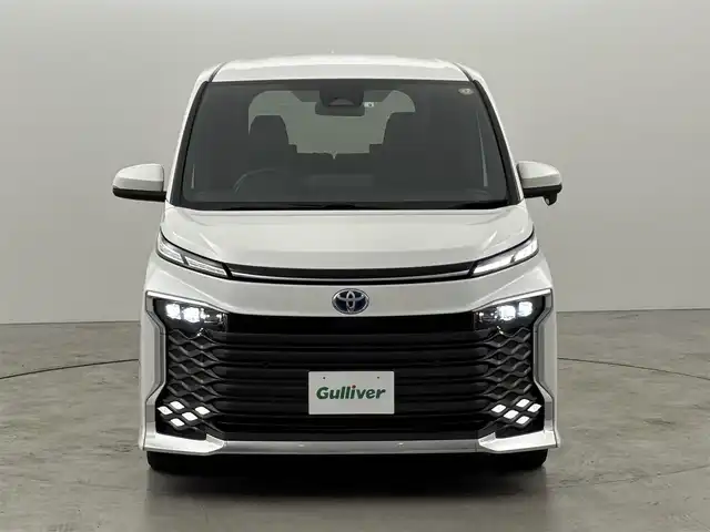 トヨタ ヴォクシー ハイブリッド S－Z 福岡県 2022(令4)年 3.1万km ホワイトパールクリスタルシャイン ワンオーナー　/１４型後席モニター　/純正１０．５型ＤＡナビ　/バックカメラ　/ビルトインＥＴＣ２．０　/レーダークルーズコントロール　/コーナーセンサー　/衝突被害軽減ブレーキ　/アクセル踏み間違い防止　/両側電動スライドドア　/シートヒーター　/ハーフレザーシート　/純正１７インチアルミホイール　/ＬＥＤヘッドライト