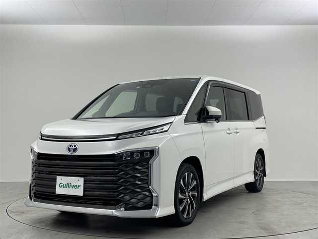 トヨタ ヴォクシー ハイブリッド S－Z 埼玉県 2022(令4)年 3.2万km ホワイトパールクリスタルシャイン 純正14インチフリップダウンモニター　純正ディスプレイ　ナビ　フルセグ　Bluetooth　レーダークルーズコントロール　快適便パッケージHi　トヨタセーフティセンス　両側パワースライドドア　パワーバックドア　ステアリングヒーター　シートヒーター　ＬＥＤヘッドライト　電動パーキングブレーキ　ブレーキホールド　プッシュスタート　スマートキー