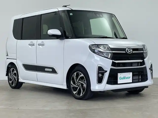 ダイハツ タント カスタム RS スタイルセレクション 鹿児島県 2022(令4)年 1.8万km シャイニングホワイトパール スマートアシストIII/ディーラーオプションナビ/（Bluetooth/CD/DVD/AM/FM/フルセグTV）/アイドリングストップ/ターボ/スペアキー/純正フリップダウンモニター/ビルトインETC/バックカメラ/全方位カメラ/ベンチシート/前後ドライブレコーダー/純正フロアマット/前席シートヒーター/ハーフレザーシート/両側パワースライドドア/純正15インチAW/前後コーナーセンサー/レーンキープアシスト/レーダークルーズコントロール/革巻ステアリング/電動パーキングブレーキ/オートホールド