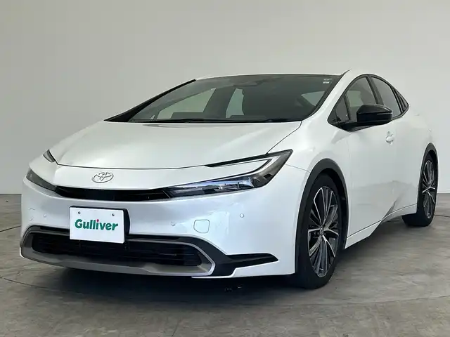 トヨタ プリウス G 三重県 2023(令5)年 1.3万km プラチナホワイトパールマイカ 禁煙車/純正８型ナビ　/バックカメラ　/オプション１９インチＡＷ　/車高調（ノーマルサス積込）　/ＢＳＭ　/社外デジタルミラー型ドラレコ　/１００Ｖ電源　/衝突軽減ブレーキ/レーダークルーズコントロール　/ＥＴＣ２．０　/ＬＥＤライト/オートライト/オートハイビーム機能