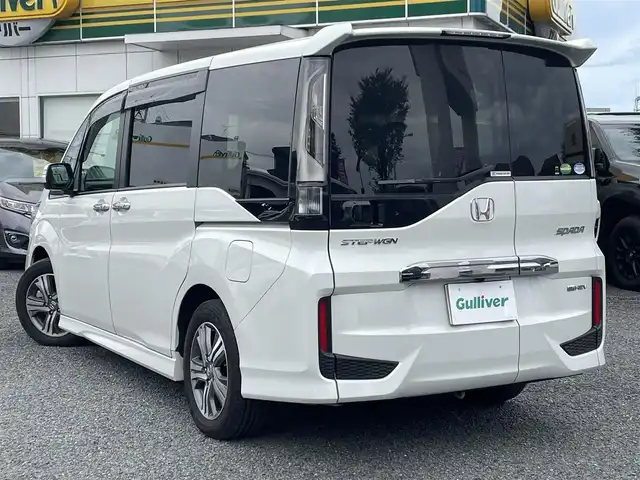 ホンダ ステップワゴン スパーダ eHEV G EXホンダS 大阪府 2021(令3)年 1.4万km プラチナホワイトパール ワンオーナー/ハーフレーザー/前席シートヒーター/純正ＳＤナビ＆フルセグＴＶ/（ＤＶＤ＆ＣＤ＆ＳＤ＆ＢＴ＆ＵＳＢ）/バックカメラ/ビルトインＥＴＣ２．０/前後ドライブレコーダー/衝突軽減ブレーキ/アダプティブクルーズコントロール/先行車発進通知/車線逸脱防止/レーンキープアシスト/標識検知/両側パワースライドドア/オートホールド/純正エアロ/純正１６inアルミホイール/オートライト/ＬＥＤライト/フォグランプ/電動格納ミラー/スマートキー/プッシュスタート/Ｗ＆サイド＆カーテンエアバッグ/横滑り防止装置/ＡＢＳ/ドアバイザー/フロアマット/新車保証書/取扱説明書（車両＆ナビ）/スマートスペアキー有