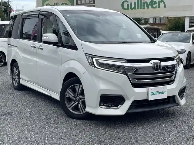 ホンダ ステップワゴン スパーダ eHEV G EXホンダS 大阪府 2021(令3)年 1.4万km プラチナホワイトパール ワンオーナー/ハーフレーザー/前席シートヒーター/純正ＳＤナビ＆フルセグＴＶ/（ＤＶＤ＆ＣＤ＆ＳＤ＆ＢＴ＆ＵＳＢ）/バックカメラ/ビルトインＥＴＣ２．０/前後ドライブレコーダー/衝突軽減ブレーキ/アダプティブクルーズコントロール/先行車発進通知/車線逸脱防止/レーンキープアシスト/標識検知/両側パワースライドドア/オートホールド/純正エアロ/純正１６inアルミホイール/オートライト/ＬＥＤライト/フォグランプ/電動格納ミラー/スマートキー/プッシュスタート/Ｗ＆サイド＆カーテンエアバッグ/横滑り防止装置/ＡＢＳ/ドアバイザー/フロアマット/新車保証書/取扱説明書（車両＆ナビ）/スマートスペアキー有