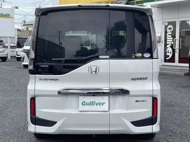 ホンダ ステップワゴン スパーダ eHEV G EXホンダS 大阪府 2021(令3)年 1.4万km プラチナホワイトパール ワンオーナー/ハーフレーザー/前席シートヒーター/純正ＳＤナビ＆フルセグＴＶ/（ＤＶＤ＆ＣＤ＆ＳＤ＆ＢＴ＆ＵＳＢ）/バックカメラ/ビルトインＥＴＣ２．０/前後ドライブレコーダー/衝突軽減ブレーキ/アダプティブクルーズコントロール/先行車発進通知/車線逸脱防止/レーンキープアシスト/標識検知/両側パワースライドドア/オートホールド/純正エアロ/純正１６inアルミホイール/オートライト/ＬＥＤライト/フォグランプ/電動格納ミラー/スマートキー/プッシュスタート/Ｗ＆サイド＆カーテンエアバッグ/横滑り防止装置/ＡＢＳ/ドアバイザー/フロアマット/新車保証書/取扱説明書（車両＆ナビ）/スマートスペアキー有