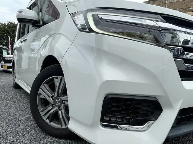 ホンダ ステップワゴン スパーダ eHEV G EXホンダS 大阪府 2021(令3)年 1.4万km プラチナホワイトパール ワンオーナー/ハーフレーザー/前席シートヒーター/純正ＳＤナビ＆フルセグＴＶ/（ＤＶＤ＆ＣＤ＆ＳＤ＆ＢＴ＆ＵＳＢ）/バックカメラ/ビルトインＥＴＣ２．０/前後ドライブレコーダー/衝突軽減ブレーキ/アダプティブクルーズコントロール/先行車発進通知/車線逸脱防止/レーンキープアシスト/標識検知/両側パワースライドドア/オートホールド/純正エアロ/純正１６inアルミホイール/オートライト/ＬＥＤライト/フォグランプ/電動格納ミラー/スマートキー/プッシュスタート/Ｗ＆サイド＆カーテンエアバッグ/横滑り防止装置/ＡＢＳ/ドアバイザー/フロアマット/新車保証書/取扱説明書（車両＆ナビ）/スマートスペアキー有