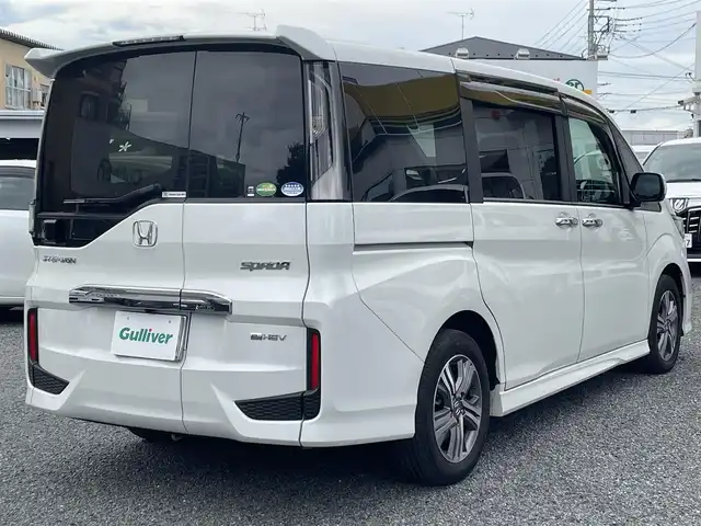 ホンダ ステップワゴン スパーダ eHEV G EXホンダS 大阪府 2021(令3)年 1.4万km プラチナホワイトパール ワンオーナー/ハーフレーザー/前席シートヒーター/純正ＳＤナビ＆フルセグＴＶ/（ＤＶＤ＆ＣＤ＆ＳＤ＆ＢＴ＆ＵＳＢ）/バックカメラ/ビルトインＥＴＣ２．０/前後ドライブレコーダー/衝突軽減ブレーキ/アダプティブクルーズコントロール/先行車発進通知/車線逸脱防止/レーンキープアシスト/標識検知/両側パワースライドドア/オートホールド/純正エアロ/純正１６inアルミホイール/オートライト/ＬＥＤライト/フォグランプ/電動格納ミラー/スマートキー/プッシュスタート/Ｗ＆サイド＆カーテンエアバッグ/横滑り防止装置/ＡＢＳ/ドアバイザー/フロアマット/新車保証書/取扱説明書（車両＆ナビ）/スマートスペアキー有