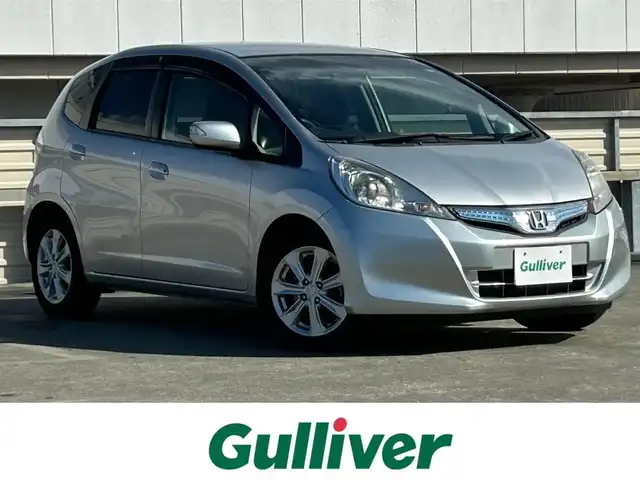 ホンダ フィット ハイブリット スマート セレクション 静岡県 2011(平23)年 2.9万km アラバスターシルバーメタリック 社外7インチナビ/（CD/DVD/FM/AM/USB）/ワンセグTV/バックカメラ/オートライト/ETC車載器/スマートキー/クルーズコントロール/オートエアコン/純正15AW