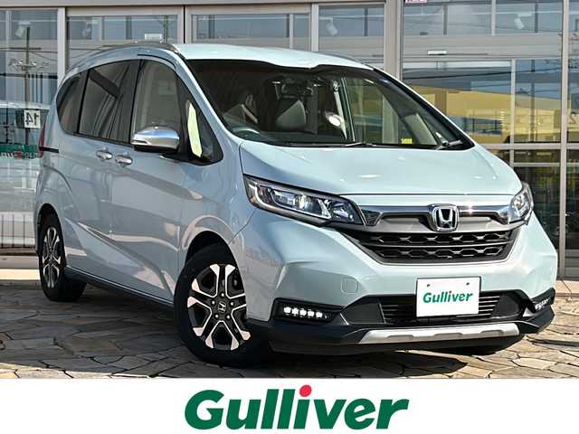ホンダ フリード クロスター 静岡県 2022(令4)年 2万km フィヨルドミストパール 純正ナビ（CD DVD AM FM フルセグTV SD Bluetooth）バックカメラ/クルーズコントロール追従あり/両側パワースライドドア/シートヒーター/ドライブレコーダー/ホンダセンシング/ETC/ウォークスルー/LEDヘッドライト/純正アルミホイール/プリクラッシュ/ステアリングリモコン/アイドリングストップ