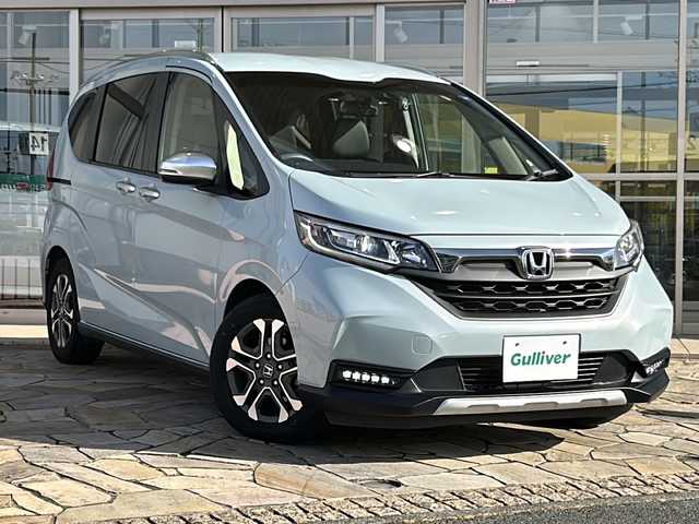 ホンダ フリード クロスター 静岡県 2022(令4)年 2万km フィヨルドミストパール 純正ナビ（CD DVD AM FM フルセグTV SD Bluetooth）バックカメラ/クルーズコントロール追従あり/両側パワースライドドア/シートヒーター/ドライブレコーダー/ホンダセンシング/ETC/ウォークスルー/LEDヘッドライト/純正アルミホイール/プリクラッシュ/ステアリングリモコン/アイドリングストップ