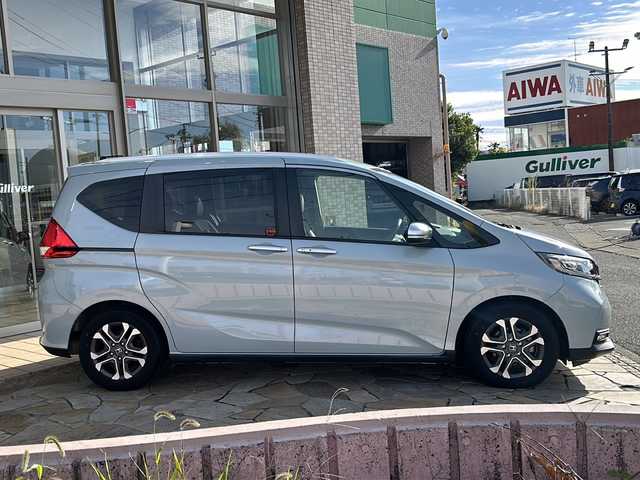 ホンダ フリード クロスター 静岡県 2022(令4)年 2万km フィヨルドミストパール 純正ナビ（CD DVD AM FM フルセグTV SD Bluetooth）バックカメラ/クルーズコントロール追従あり/両側パワースライドドア/シートヒーター/ドライブレコーダー/ホンダセンシング/ETC/ウォークスルー/LEDヘッドライト/純正アルミホイール/プリクラッシュ/ステアリングリモコン/アイドリングストップ