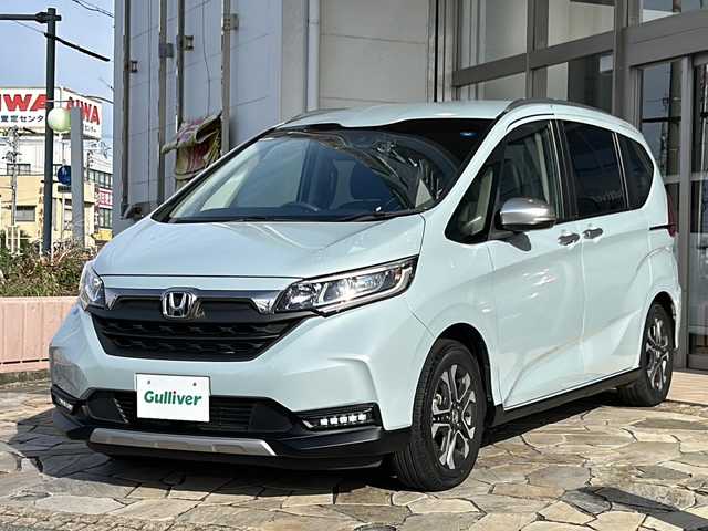 ホンダ フリード クロスター 静岡県 2022(令4)年 2万km フィヨルドミストパール 純正ナビ（CD DVD AM FM フルセグTV SD Bluetooth）バックカメラ/クルーズコントロール追従あり/両側パワースライドドア/シートヒーター/ドライブレコーダー/ホンダセンシング/ETC/ウォークスルー/LEDヘッドライト/純正アルミホイール/プリクラッシュ/ステアリングリモコン/アイドリングストップ