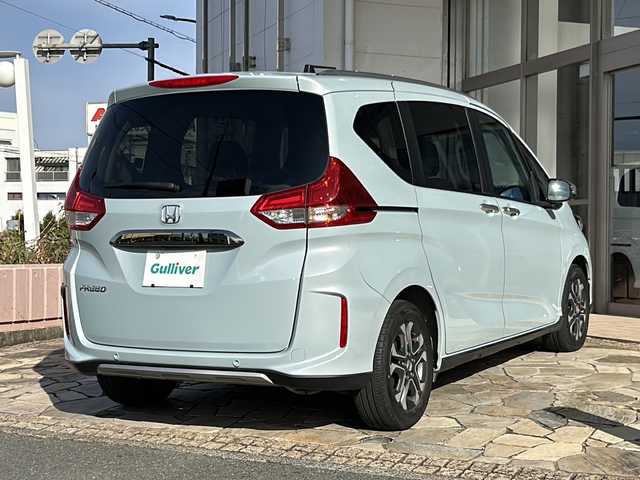 ホンダ フリード クロスター 静岡県 2022(令4)年 2万km フィヨルドミストパール 純正ナビ（CD DVD AM FM フルセグTV SD Bluetooth）バックカメラ/クルーズコントロール追従あり/両側パワースライドドア/シートヒーター/ドライブレコーダー/ホンダセンシング/ETC/ウォークスルー/LEDヘッドライト/純正アルミホイール/プリクラッシュ/ステアリングリモコン/アイドリングストップ