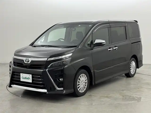 トヨタ ヴォクシー ZS 煌Ⅱ 福岡県 2020(令2)年 6.8万km イナズマスパーキングブラックガラスフレーク 純正１２．１型後席モニター　/純正９型ナビ　/バックカメラ　/ＥＴＣ２．０　/前後ドラレコ　/クルコン　/コーナーセンサー　/衝突軽減ブレーキ　/レーンキープ　/ＰＫＳＢ　/ＭＴモード付き　/両側電動スライドドア　/ＬＥＤヘッドライト