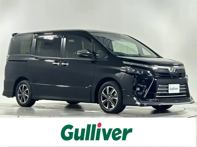 トヨタ ヴォクシー ZS 煌 佐賀県 2017(平29)年 7.3万km ブラック アルパイン10インチナビ/モデリスタエアロ/プリクラッシュセーフティ/レーンキープアシスト/オートハイビーム/クルーズコントロール/コーナーセンサー/バックカメラ/フルセグテレビ/CD/DVD/BT/SD/FM.AM/社外シートカバー/ビルトインETC/純正フロアマット/ドアバイザー/純正16インチアルミホイール/保証書/プッシュスタート/スマートキー