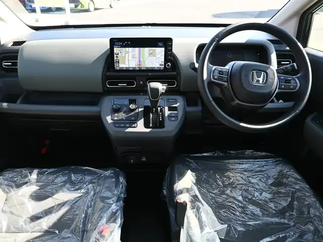 ホンダ フリード ハイブリット e:HEV クロスター 千葉県 2025(令7)年 0.1千km メテオロイドグレーメタリック e:HEV クロスター　2LE40D3　6人　9インチナビ　LXM-242ZFNI(207680円)/ホンダセンシング/・衝突軽減ブレーキ（CMBS）/・車線維持支援システム（LKAS）/・アダプティブクルーズコントロール（ACC）/・ブラインドスポットインフォメーション/・後方誤発進抑制機能/・誤発進抑制機能/両側パワースライドドア/ホンダコネクトナビ/地デジTV/【DVD/CD再生機能　Bluetooth接続】/【Apple CarPlay　Android Auto対応】/バックカメラ/革巻きステアリング/ステアリングスイッチ/LEDヘッドライト/ウインカーミラー/純正15インチアルミホイル/サイド/カーテンエアバッグ/Honda スマートキー