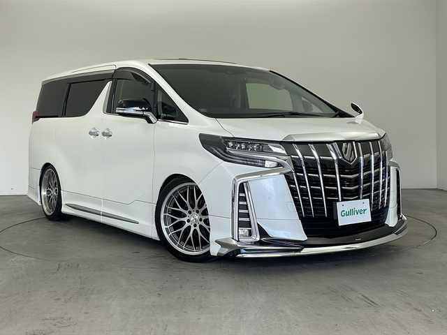 トヨタ アルファード S Cパッケージ 兵庫県 2019(平31)年 7万km ホワイトパールクリスタルシャイン ・純正ナビ&TV&CD&SD&BT&HDMI&USB/・バックカメラ/・モデリスタエアロ/・社外２０インチアルミホイール/・サンルーフ/・前後ドライブレコーダー/・革シート/・ビルトインETC/・運転席メモリー付きパワー/・前席パワーシート/・前席シートヒーター/・ベンチレーション/・2列目オットマン/・助手席オットマン/・ステアリングヒーター/・社外車高調/・電子パーキングブレーキ/・オートホールド/・横滑り防止装置/・ウッドコンビステアリング/・ステアリングスイッチ/・両側パワースライドドア/・パワーバックドア/・左右独立エアコン/・後席エアコン/・社外デジタルインナーミラー/・トヨタセーフティセンス/・レーンレーシングアシスト/・クリアランスソナー/・パーキングサポートブレーキ/・プリクラッシュセーフティ/・ロードサインアシスト/・レーダークルーズコントロール/・オートマチックハイビーム/・先行者発進告知/・自動防眩ミラー/・3眼LEDライト/・LEDフォグランプ/・シーケンシャルウィンカー/・オートワイパー/・オートライト/・フォグランプ/・ウインカーミラー/・ドアバイザー/・純正フロアマット