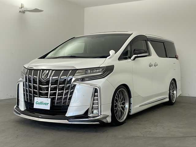 トヨタ アルファード S Cパッケージ 兵庫県 2019(平31)年 7万km ホワイトパールクリスタルシャイン ・純正ナビ&TV&CD&SD&BT&HDMI&USB/・バックカメラ/・モデリスタエアロ/・社外２０インチアルミホイール/・サンルーフ/・前後ドライブレコーダー/・革シート/・ビルトインETC/・運転席メモリー付きパワー/・前席パワーシート/・前席シートヒーター/・ベンチレーション/・2列目オットマン/・助手席オットマン/・ステアリングヒーター/・社外車高調/・電子パーキングブレーキ/・オートホールド/・横滑り防止装置/・ウッドコンビステアリング/・ステアリングスイッチ/・両側パワースライドドア/・パワーバックドア/・左右独立エアコン/・後席エアコン/・社外デジタルインナーミラー/・トヨタセーフティセンス/・レーンレーシングアシスト/・クリアランスソナー/・パーキングサポートブレーキ/・プリクラッシュセーフティ/・ロードサインアシスト/・レーダークルーズコントロール/・オートマチックハイビーム/・先行者発進告知/・自動防眩ミラー/・3眼LEDライト/・LEDフォグランプ/・シーケンシャルウィンカー/・オートワイパー/・オートライト/・フォグランプ/・ウインカーミラー/・ドアバイザー/・純正フロアマット