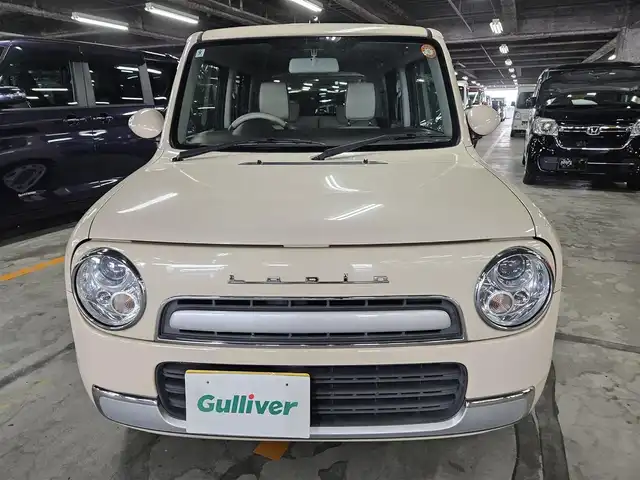 スズキ ラパン X 長崎県 2014(平26)年 5.4万km ミルクティーベージュメタリック 純正MOPナビ/ワンセグTV/バックカメラ/HIDヘッドランプ/オートライト/オートエアコン/革巻きステアリング/キルティングレザー調シート/純正14インチアルミホイール/スマートキー/イモビライザー/プッシュエンジンスタート/禁煙車