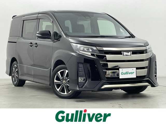 トヨタ ノア Si 群馬県 2018(平30)年 6.5万km ブラック リヤオートエアコン/ワンタッチスイッチ付き両側パワースライドドア/――――――――――――――――/純正12.1インチフリップダウンモニター/純正10インチSDナビ/フルセグTV/Bluetooth/CD/DVD/SD/バックカメラ/トヨタセーフティセンス/・プリクラッシュセーフティ/・レーンディパーチャーアラート/・オートハイビーム/・先行車発進お知らせ/クルーズコントロール/ビルトインETC2.0/純正ドライブレコーダー/LEDヘッドライト/フォグランプ/プッシュスタート/スマートキー