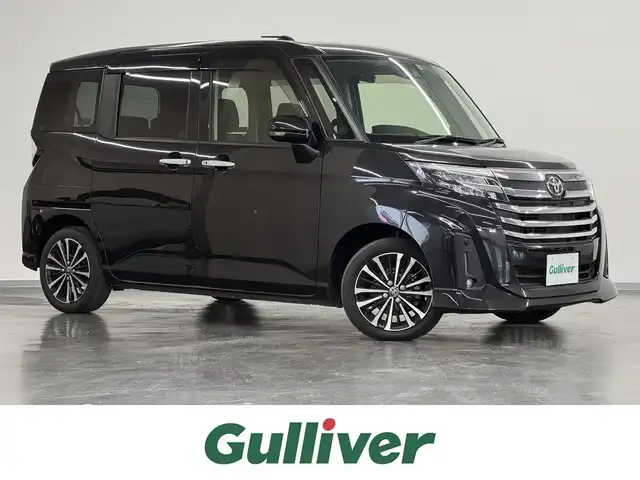 トヨタ ルーミー カスタムG－T 三重県 2021(令3)年 2.3万km ブラックマイカメタリック ガソリン・ターボ/FF/インパネCVT/純正 9インチ ディスプレイオーディオ/（FM/AM/TV/Bluetooth/USB/iPod/CarPlay/AndroidAuto）/バックガイドモニター/両側パワースライドドア（ワンタッチオープン機能・タッチ＆ゴーロック機能付）/ビルトイン ETC/スマートアシスト/・衝突回避支援ブレーキ機能（対車両・対歩行者［昼夜］）/・車線逸脱警報機能/・路側逸脱警報/・ふらつき警報/・全車速追従機能付アダプティブクルーズコントロール/・コーナーセンサー（フロント2個/リヤ2個）/・ブレーキ制御付誤発進抑制機能（前方・後方）/・標識認識機能（進入禁止／最高速度／一時停止）/・先行車発進お知らせ機能/装備/・オートライトシステム/・オートレベリング機能付LEDヘッドランプ/・LEDフロントフォグランプ/・オートハイビーム/・オートエアコン/・プッシュスタート/・電子パーキングブレーキ/・ブレーキホールド機能/・純正15inAW/・保/・スマートキーx2