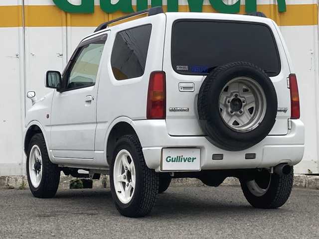 スズキ ジムニー XC 埼玉県 2003(平15)年 13.6万km スペリアホワイト ４ＷＤ/ターボ/スズキスポーツマフラー/ヒーテッドドアミラー/社外ＭＯＭＯステアリング/社外１６inアルミホイール/ルーフレール/電動格納ミラー/ＡＢＳ/ドアバイザー/フロアマット/新車保証書/取扱説明書