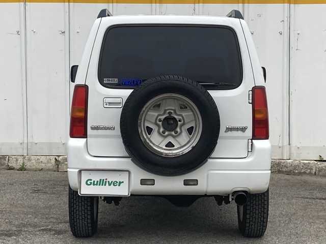 スズキ ジムニー XC 埼玉県 2003(平15)年 13.6万km スペリアホワイト ４ＷＤ/ターボ/スズキスポーツマフラー/ヒーテッドドアミラー/社外ＭＯＭＯステアリング/社外１６inアルミホイール/ルーフレール/電動格納ミラー/ＡＢＳ/ドアバイザー/フロアマット/新車保証書/取扱説明書